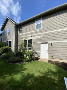 Siding with multiple slats painted different colors before repaint - Lebanon