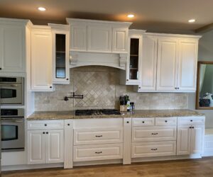 Kitchen cabinets professionally painted in glossy cream - Albany